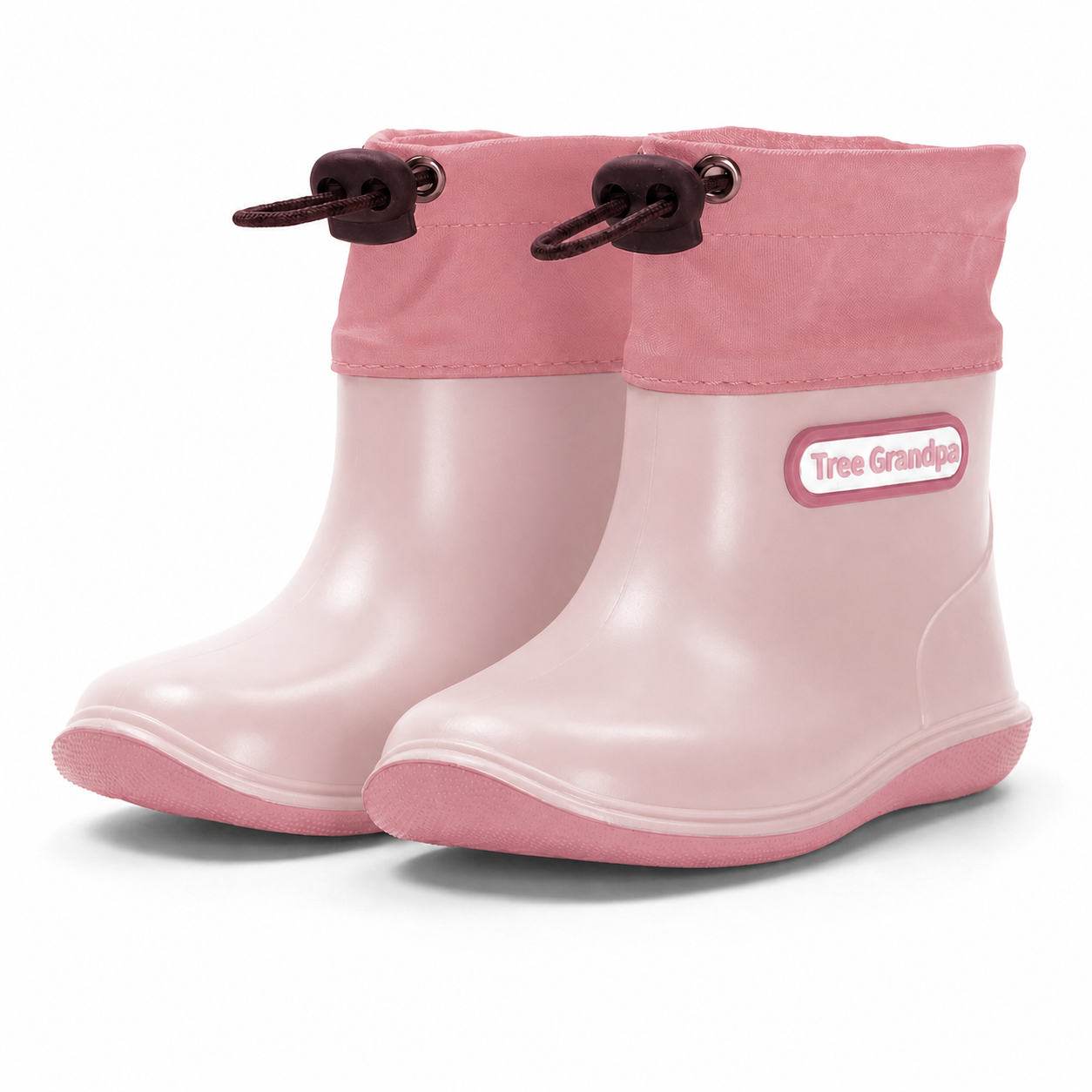 A pair of toddler rain boots in light pink with a darker pink cuff and dark brown drawstring loops, featuring a 'Tree Grandpa' brand patch on the side, set against a plain white background.
